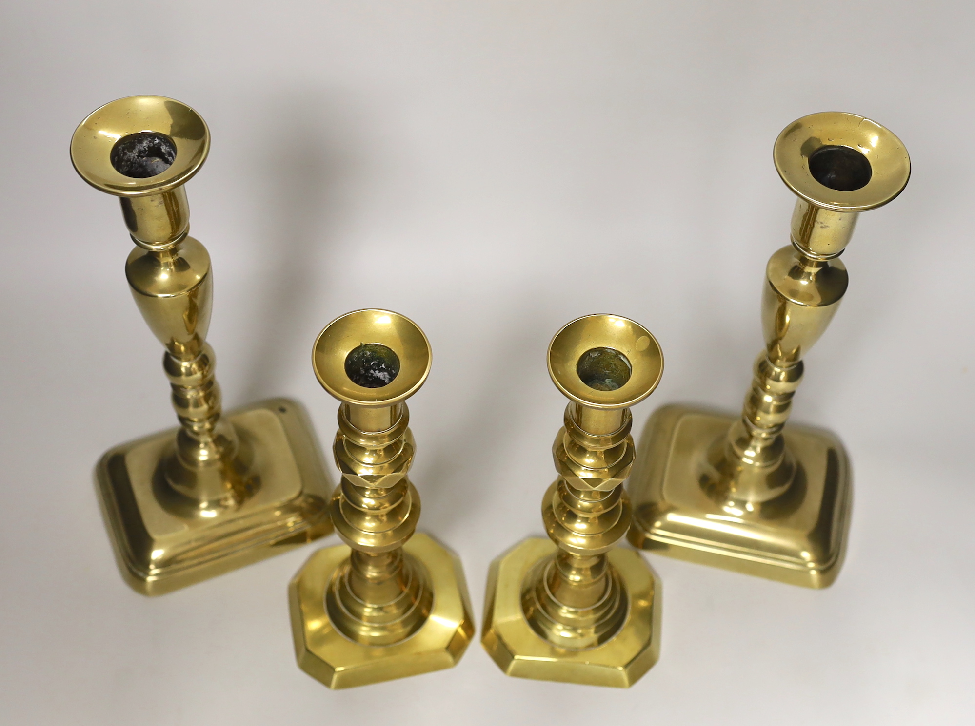 Two pairs of Victorian brass candlesticks, tallest 27cm tall